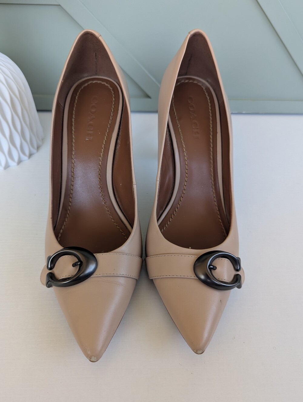 Coach Women's Nude Leather Pointed Toe Pumps with Signature Buckle